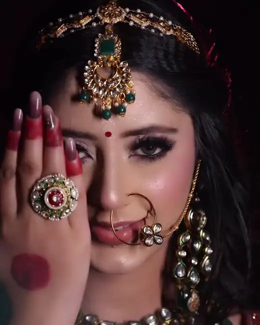Hennaed hand with bridal ring, close-up