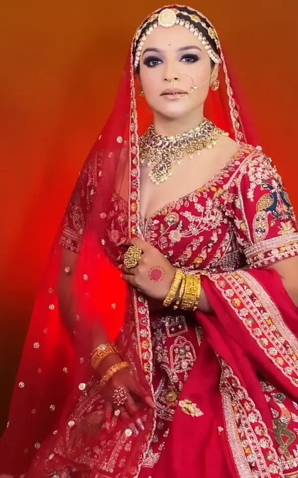 Bridal make-up, red and gold, dramatic studio backdrop