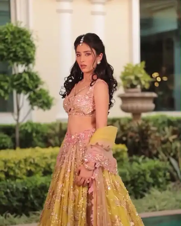 Bridal make-up, mustard lehenga, garden fountain