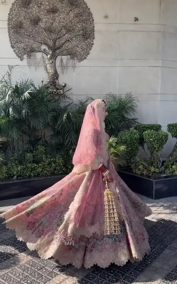 Bridal make-up, blush lehenga with a flowing train, garden