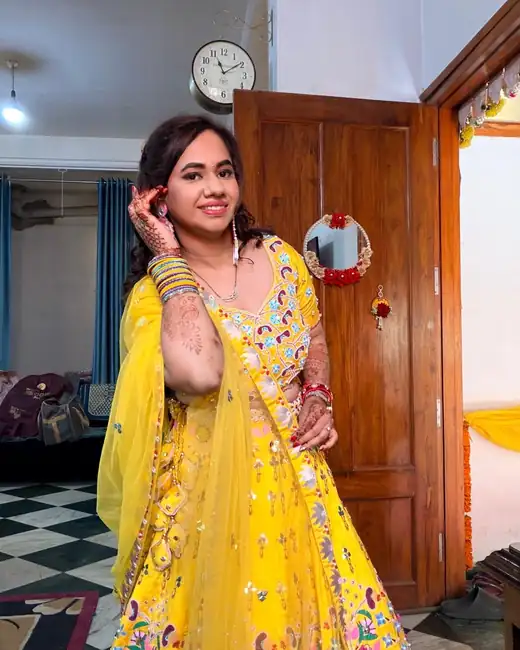 Bride getting ready at home, yellow lehenga